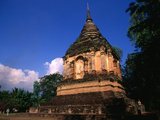 The Buddhist temple of Wat Chet Yot (Jet Yod) was constructed in 1455 CE by King Tilokarat (1441 - 1485) in the style of the Mahabodhi temple in Bodh Gaya, India. Bodh Gaya was where Siddhartha Gautama, the Buddha, attained enlightenment.<br/><br/>

Chiang Mai, sometimes written as 'Chiengmai' or 'Chiangmai', is the largest and most culturally significant city in northern Thailand, and is the capital of Chiang Mai Province. It is located 700 km (435 mi) north of Bangkok, among the highest mountains in the country. The city is on the Ping river, a major tributary of the Chao Phraya river.<br/><br/>

King Mengrai founded the city of Chiang Mai (meaning 'new city') in 1296, and it succeeded Chiang Rai as capital of the Lanna kingdom. The ruler was known as the Chao. The city was surrounded by a moat and a defensive wall, since nearby Burma was a constant threat.<br/><br/>

Chiang Mai formally became part of Siam in 1774 by an agreement with Chao Kavila, after the Thai King Taksin helped drive out the Burmese. Chiang Mai then slowly grew in cultural, trading and economic importance to its current status as the unofficial capital of northern Thailand, second in importance only to Bangkok.