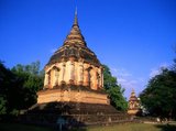 The Buddhist temple of Wat Chet Yot (Jet Yod) was constructed in 1455 CE by King Tilokarat (1441 - 1485) in the style of the Mahabodhi temple in Bodh Gaya, India. Bodh Gaya was where Siddhartha Gautama, the Buddha, attained enlightenment.<br/><br/>

Chiang Mai, sometimes written as 'Chiengmai' or 'Chiangmai', is the largest and most culturally significant city in northern Thailand, and is the capital of Chiang Mai Province. It is located 700 km (435 mi) north of Bangkok, among the highest mountains in the country. The city is on the Ping river, a major tributary of the Chao Phraya river.<br/><br/>

King Mengrai founded the city of Chiang Mai (meaning 'new city') in 1296, and it succeeded Chiang Rai as capital of the Lanna kingdom. The ruler was known as the Chao. The city was surrounded by a moat and a defensive wall, since nearby Burma was a constant threat.<br/><br/>

Chiang Mai formally became part of Siam in 1774 by an agreement with Chao Kavila, after the Thai King Taksin helped drive out the Burmese. Chiang Mai then slowly grew in cultural, trading and economic importance to its current status as the unofficial capital of northern Thailand, second in importance only to Bangkok.